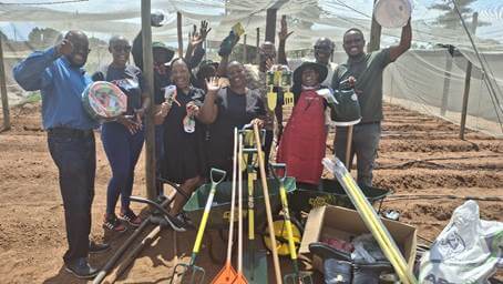 Coca Cola Beverages SA 2 Makhushaneng Community Garden beneficiaries receive their gardening equipment and seeds.